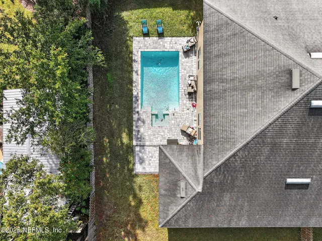an aerial view of a house with a garden and plants