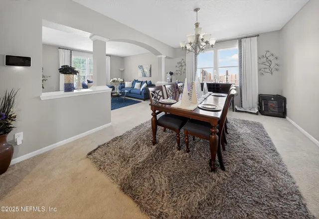 a view of a dining room with furniture