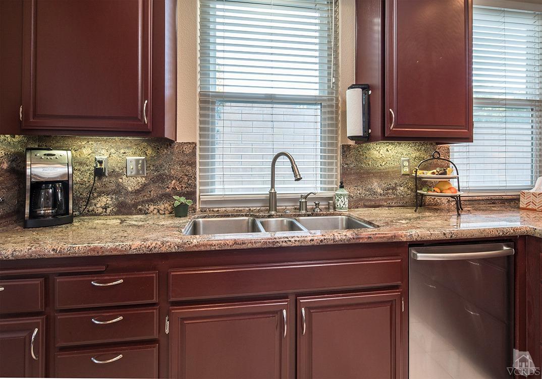 3854 Timberridge Road Moorpark, CA 93021 - Photo 14 of 33 a kitchen with granite countertop stainless steel appliances sink and cabinets