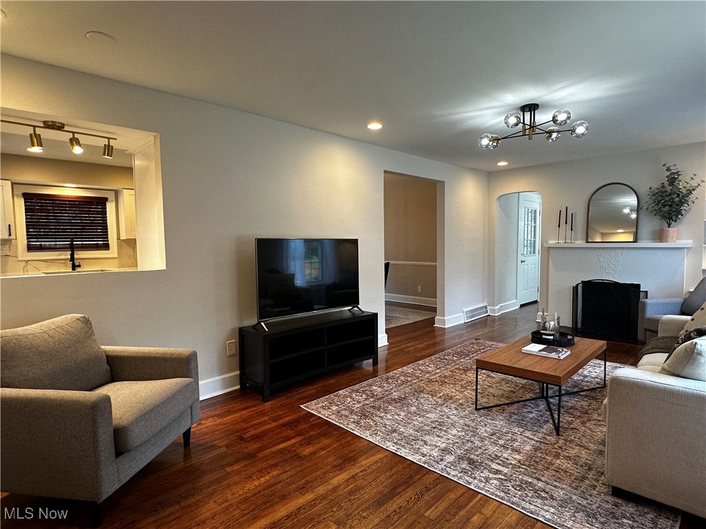 2255 Edgerton Road University Heights, OH 44118 - Photo 8 of 33 Living room with dark hardwood / wood-style flooring, rail lighting, and a notable chandelier