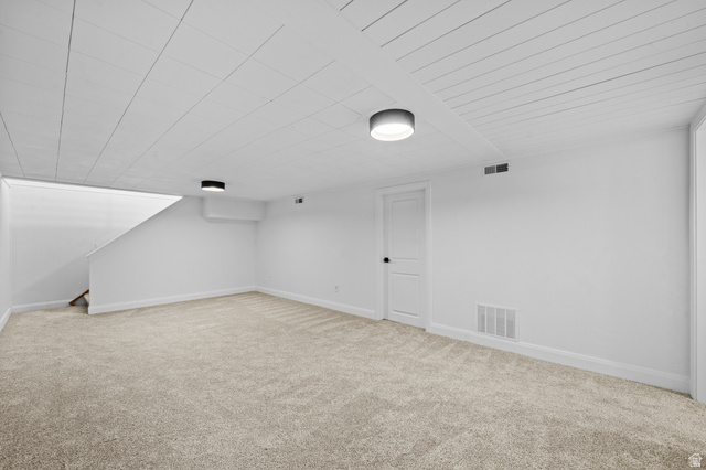 2267 West 4350th Street South Roy, UT 84067 - Photo 23 of 32 Additional living space featuring light carpet and baseboards