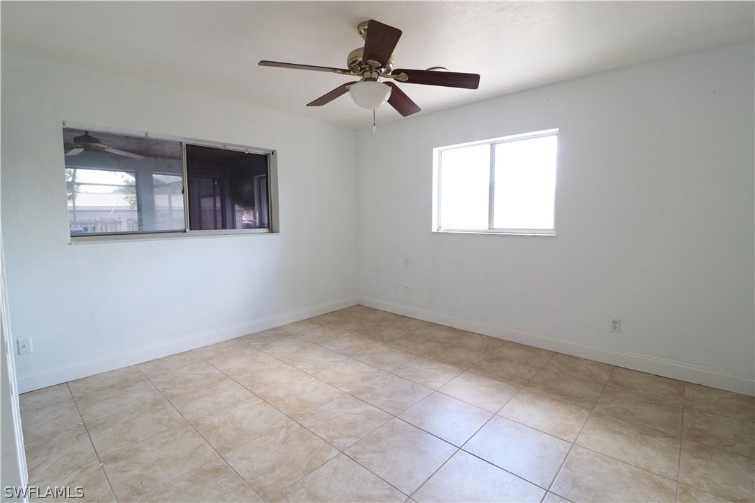 2102 Hibiscus Road Fort Myers, FL 33905 - Photo 17 of 23 a view of an empty room with a window