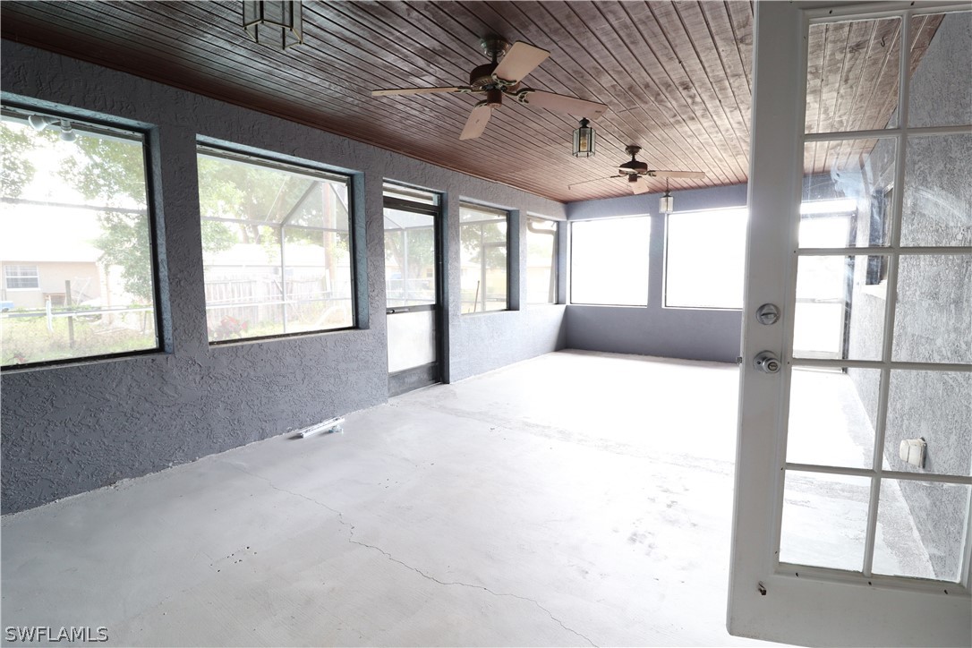 2102 Hibiscus Road Fort Myers, FL 33905 - Photo 18 of 23 a large bedroom with a large bed and a large window