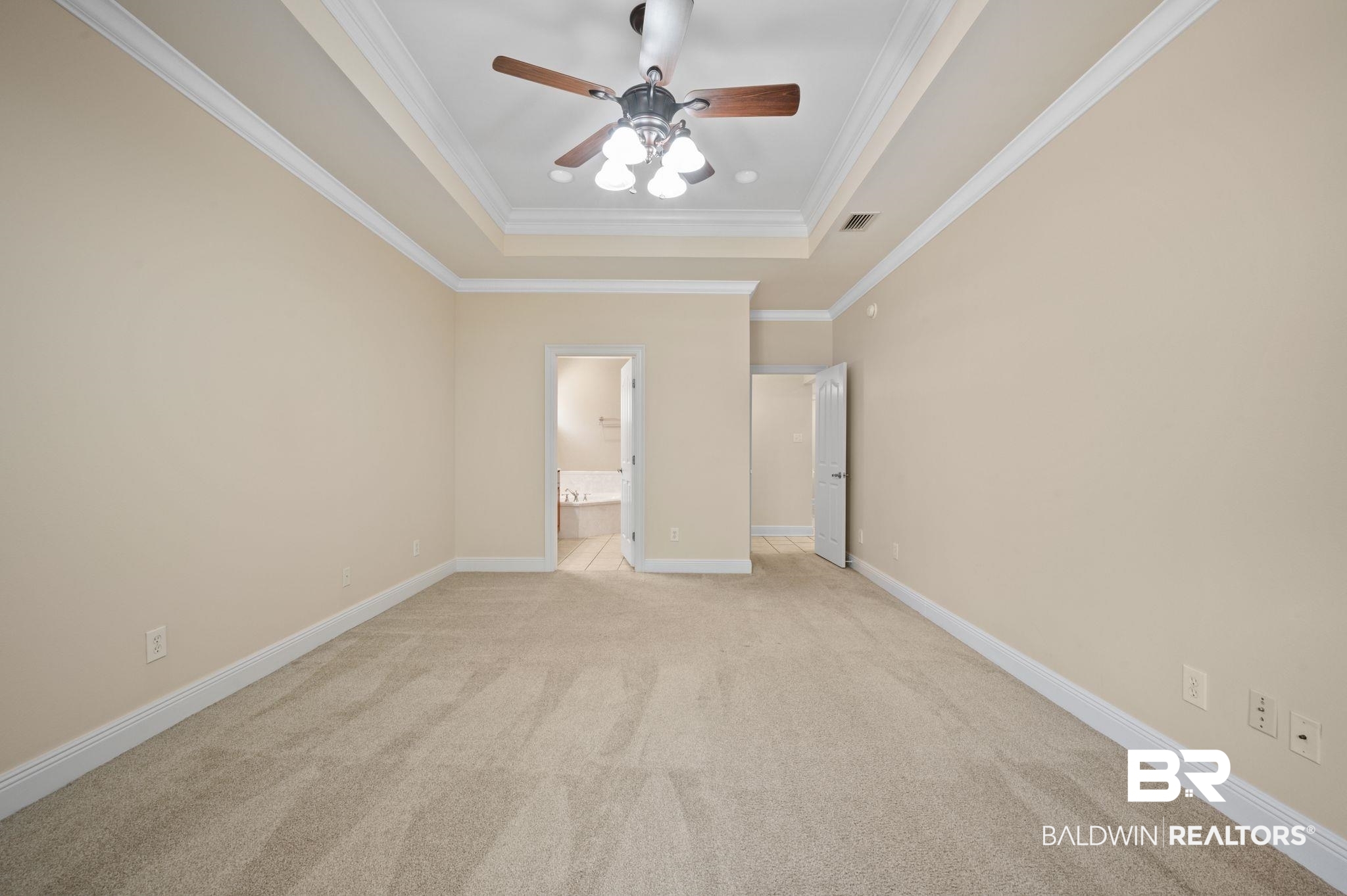 2041 Ridgeline Drive Mobile, AL 36695 - Photo 21 of 43 Unfurnished bedroom featuring connected bathroom, ceiling fan, ornamental molding, light carpet, and a raised ceiling