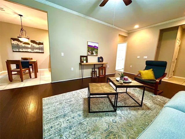 a living room with furniture and a table