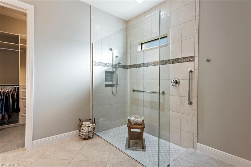 4359 Raffia Palm Circle Naples, FL 34119 - Photo 11 of 35 a bathroom with a shower