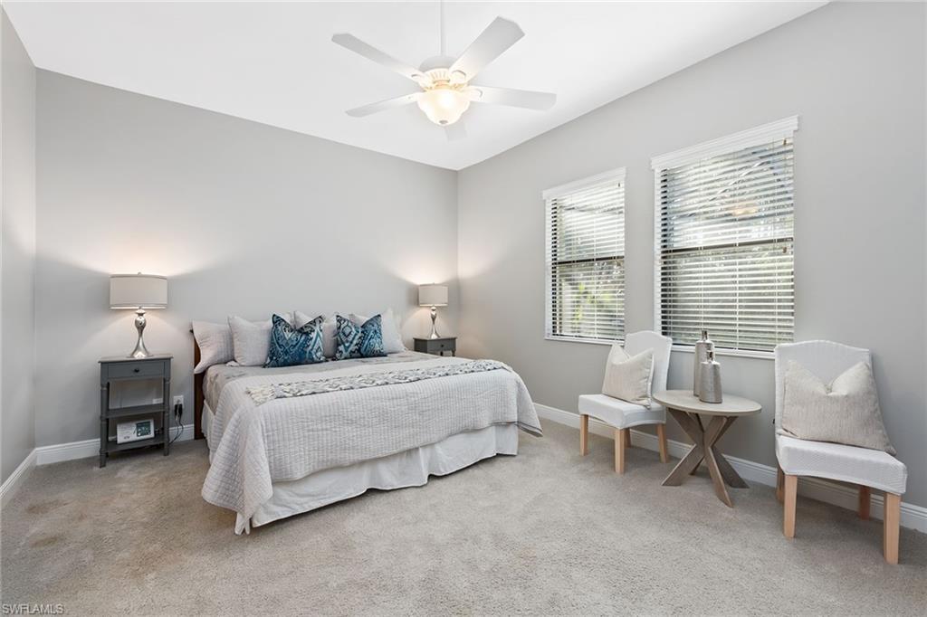 4359 Raffia Palm Circle Naples, FL 34119 - Photo 8 of 35 a bedroom with bed and a large window