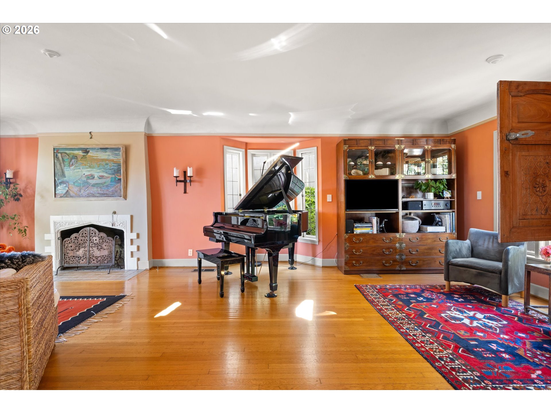 2939 Northwest Cornell Road Portland, OR 97210 - Photo 3 of 42 a living room with furniture a rug and a fireplace