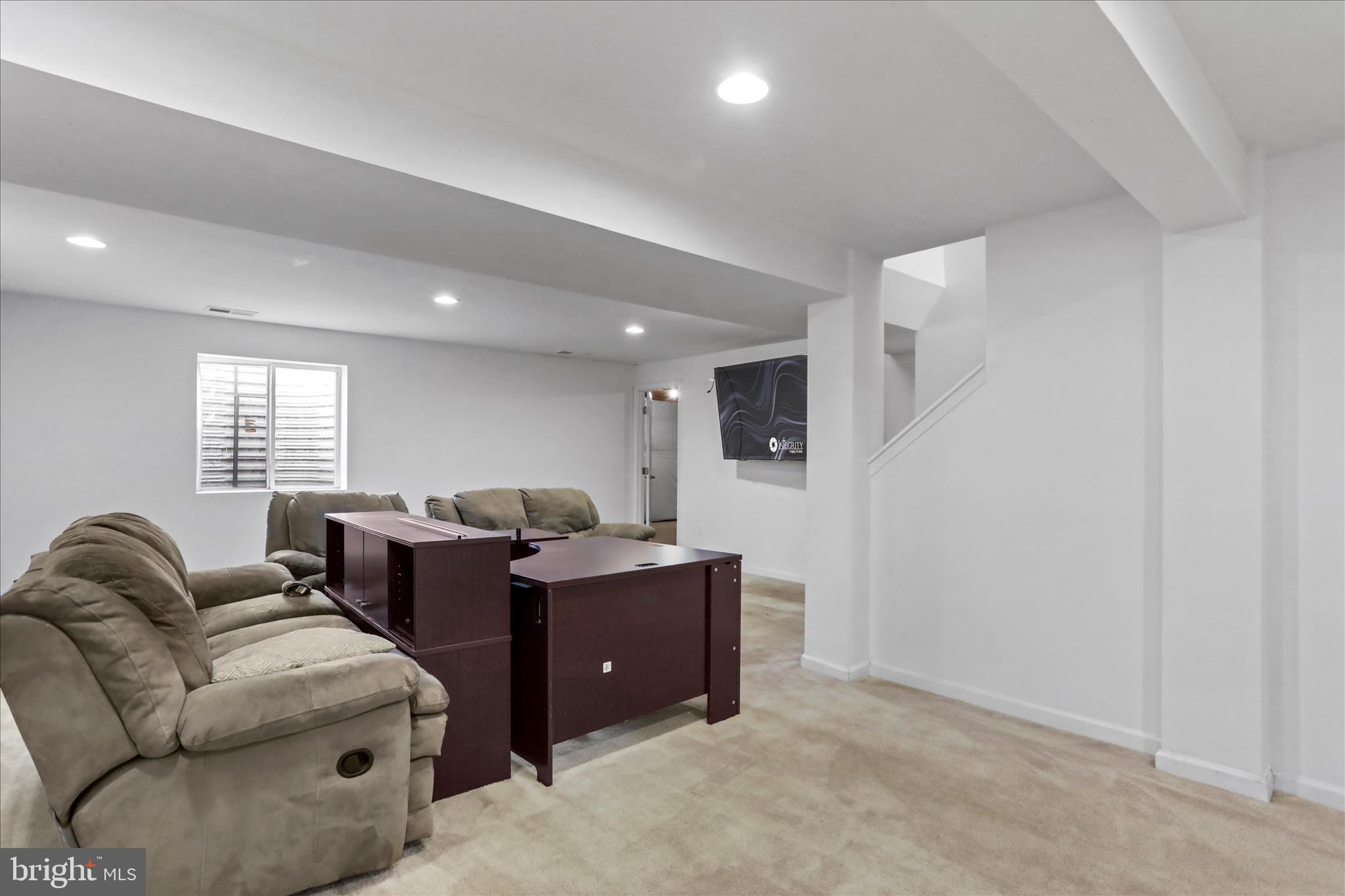 35 Sirocco Court Falling Waters, WV 25419 - Photo 30 of 45 a living room with couches and kitchen view