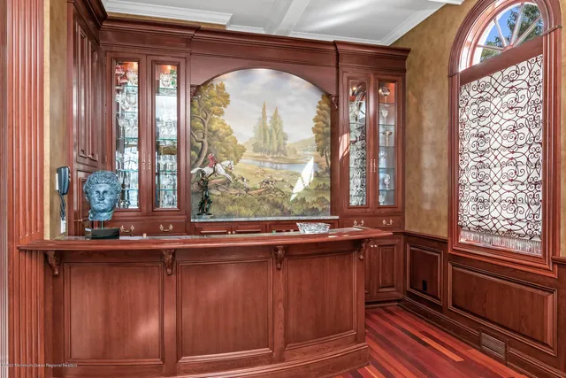 a view of a building with cars parked