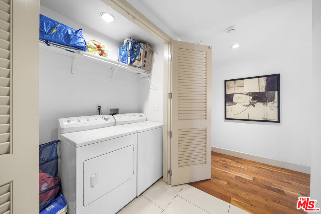 848 Irolo Street, Unit 105 Los Angeles, CA 90005 - Photo 11 of 18 a utility room with dryer and washer