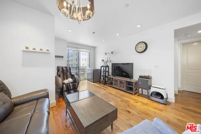 a bedroom with a bed and a tv