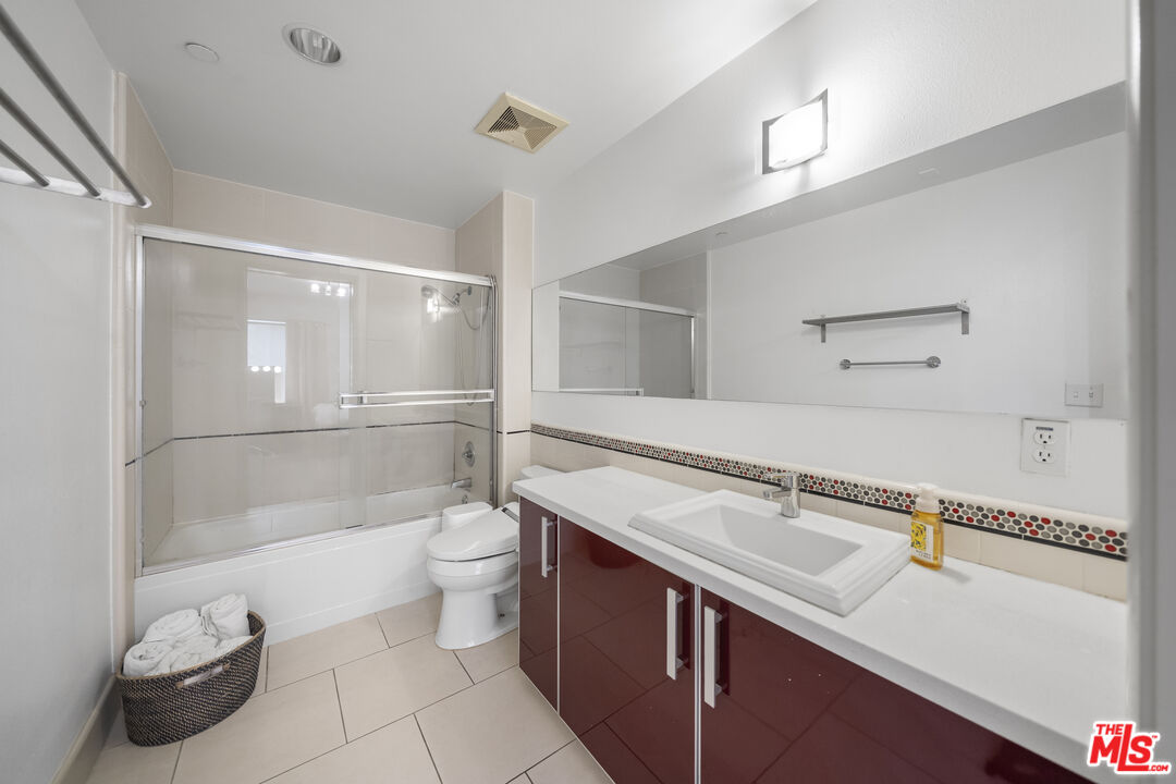 848 Irolo Street, Unit 105 Los Angeles, CA 90005 - Photo 17 of 18 a bathroom with a sink a toilet and shower