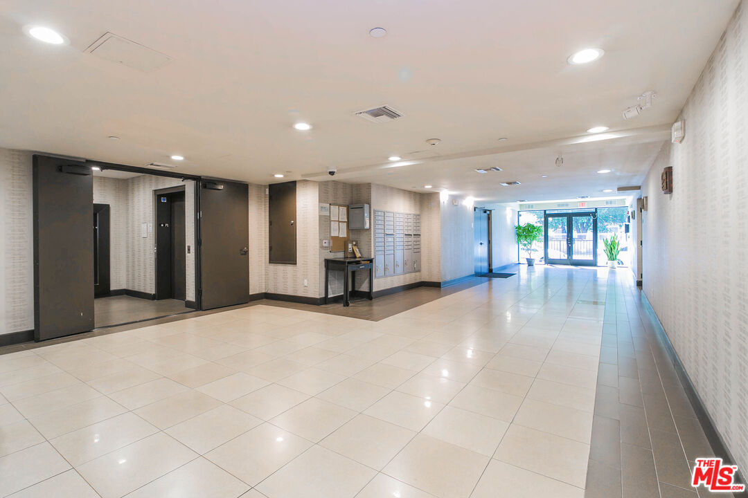 848 Irolo Street, Unit 105 Los Angeles, CA 90005 - Photo 5 of 18 a view of a hallway with an entryway