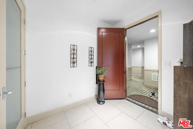 a view of a hallway with a kitchen