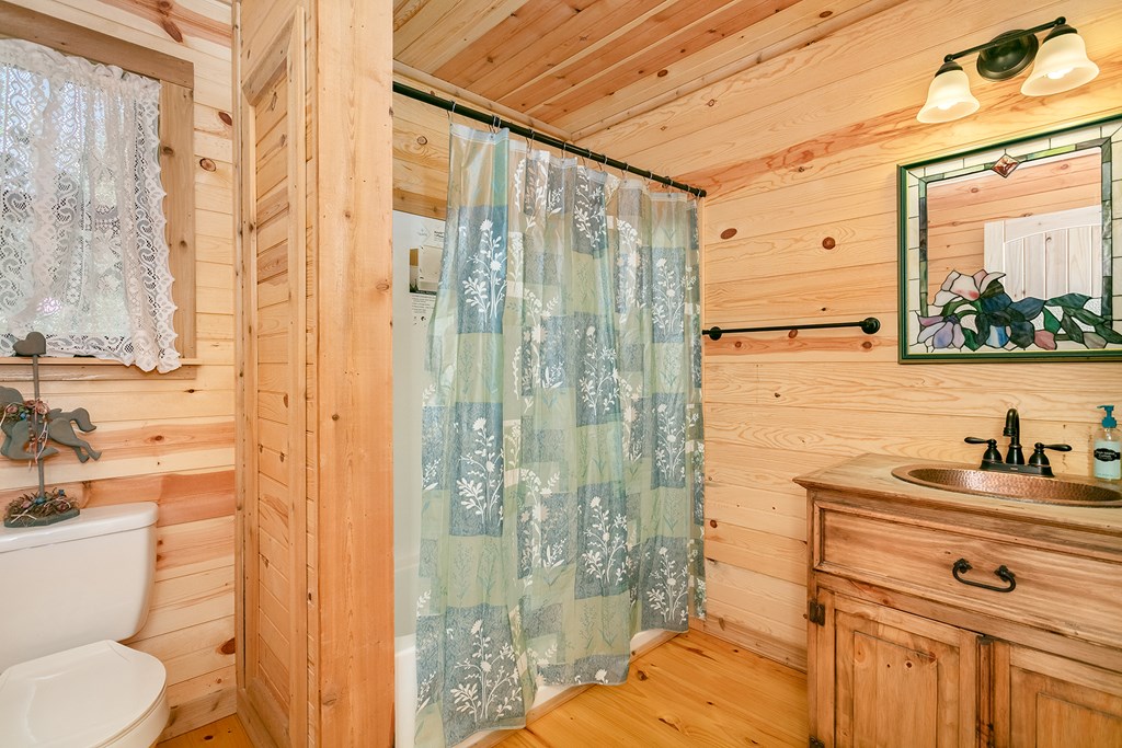 511 Bluebird Street Fredericksburg, TX 78624 - Photo 6 of 15 a bathroom with a sink and a mirror