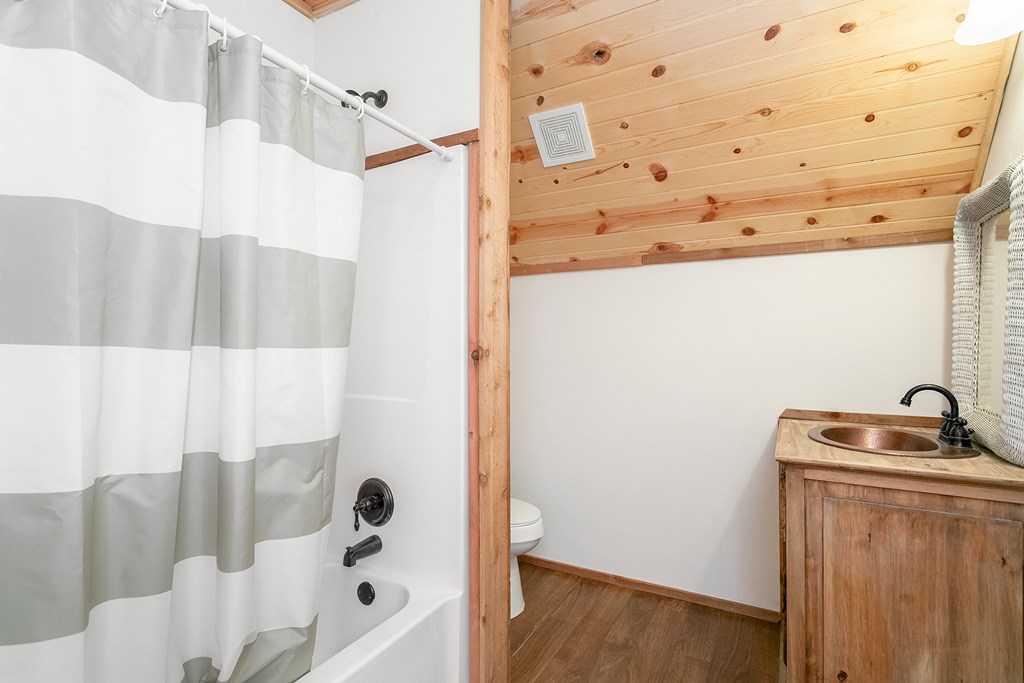511 Bluebird Street Fredericksburg, TX 78624 - Photo 10 of 15 a bathroom with a bathtub and shower