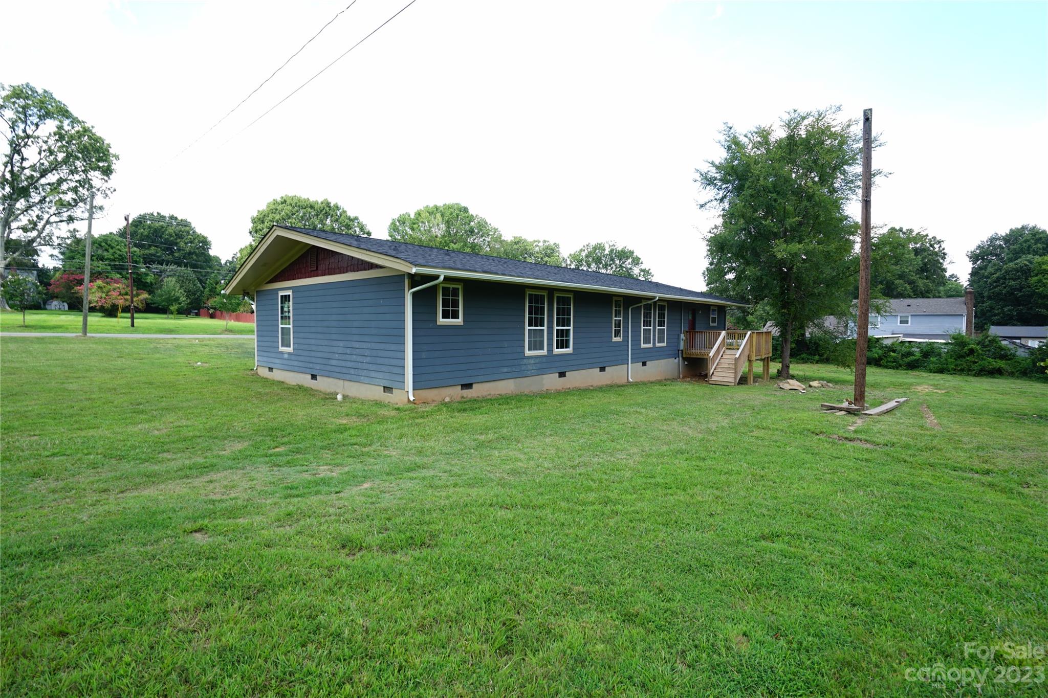1811 Little Rock Road Charlotte, NC 28214 - Photo 2 of 20 a front view of a house with a garden