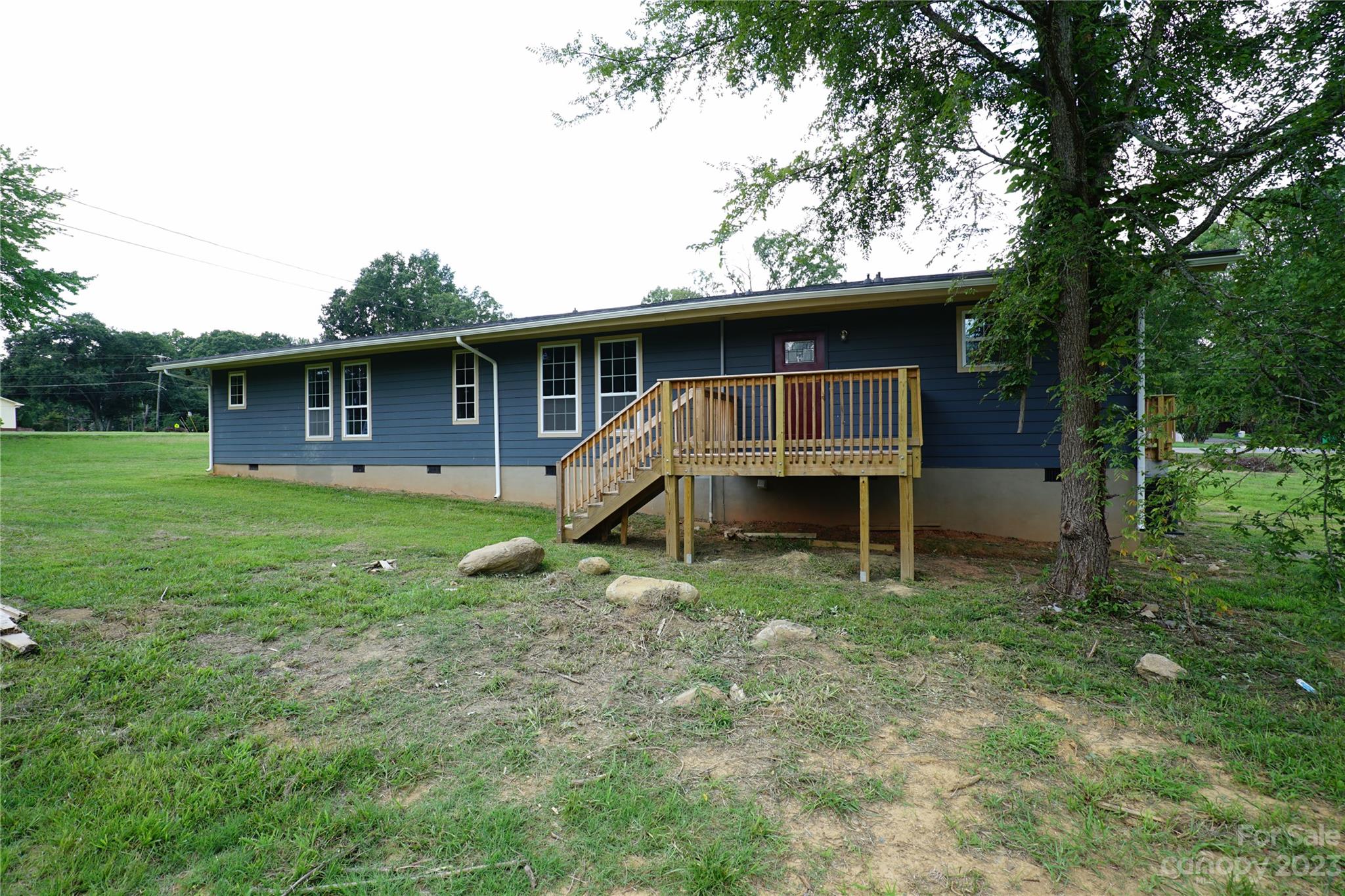 1811 Little Rock Road Charlotte, NC 28214 - Photo 3 of 20 a backyard of a house with table and chairs