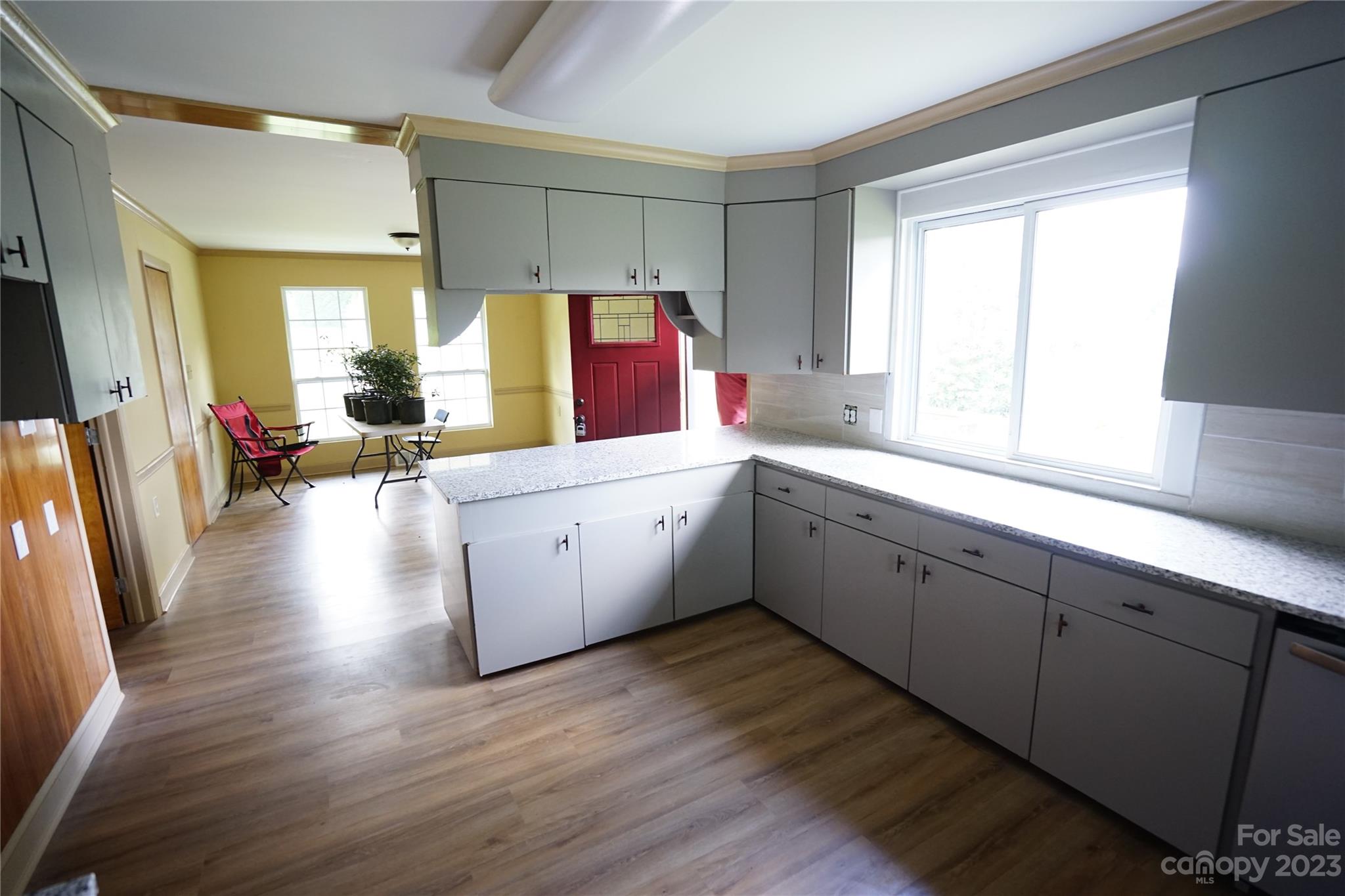 1811 Little Rock Road Charlotte, NC 28214 - Photo 5 of 20 a view of a kitchen sink and wooden floor
