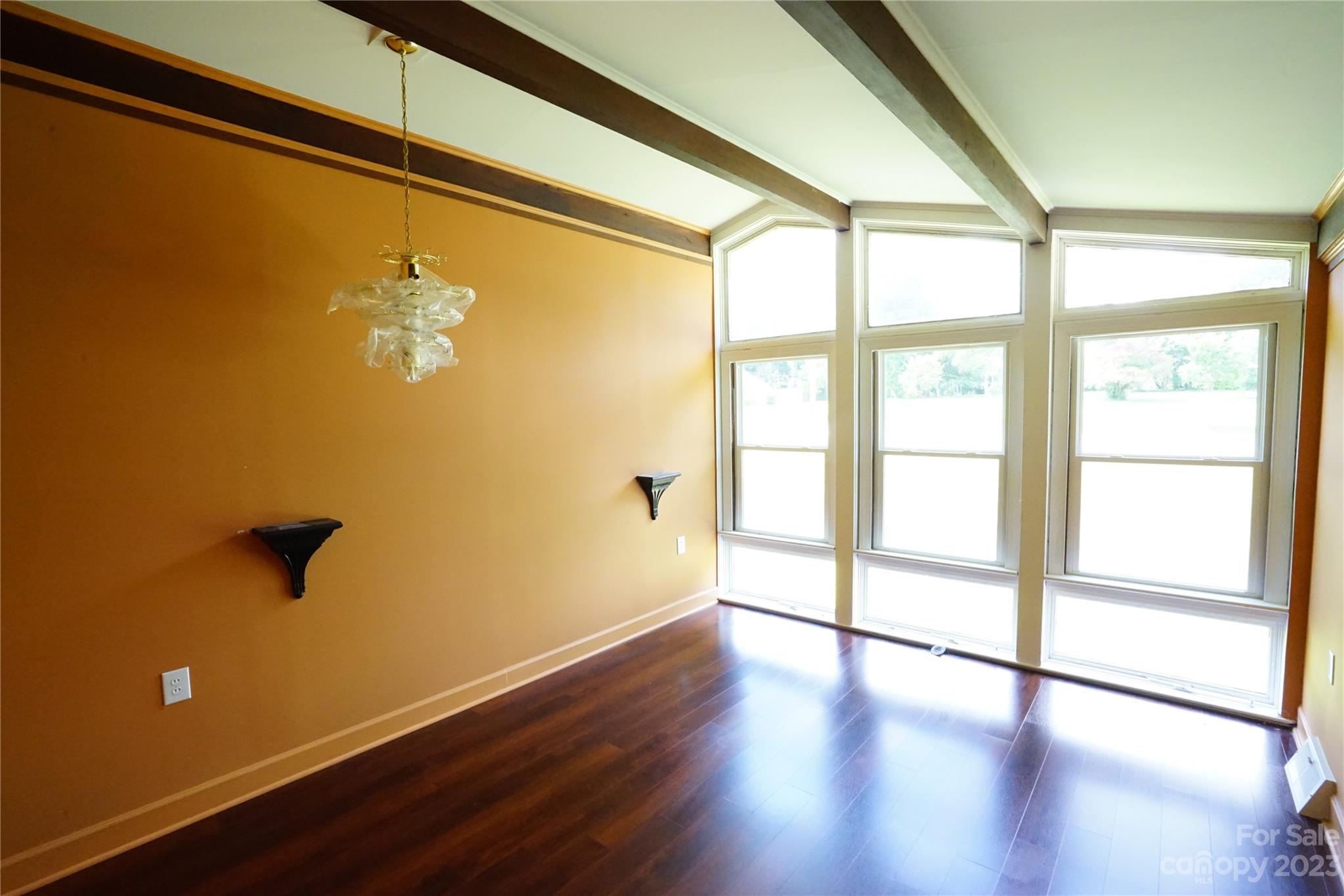 1811 Little Rock Road Charlotte, NC 28214 - Photo 10 of 20 a view of empty room with wooden floor and fan