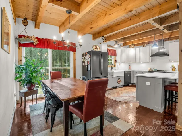 a dining room with granite countertop a table and chairs