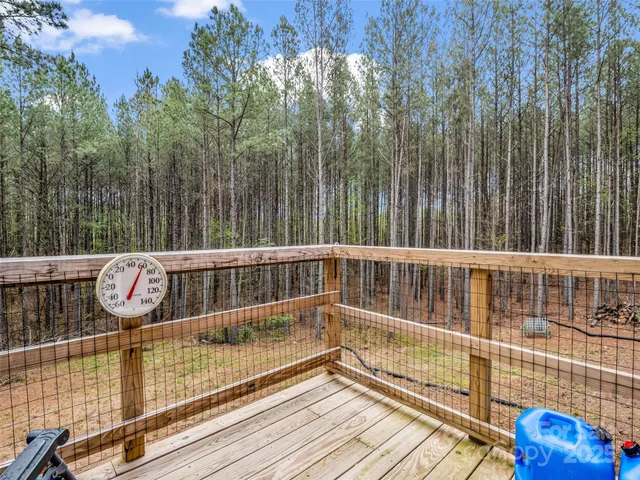 a view of balcony with wooden floor