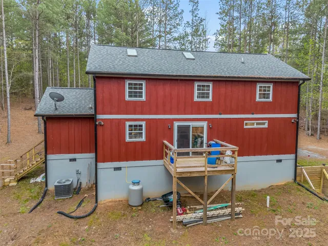 a aerial view of a house with table and chairs