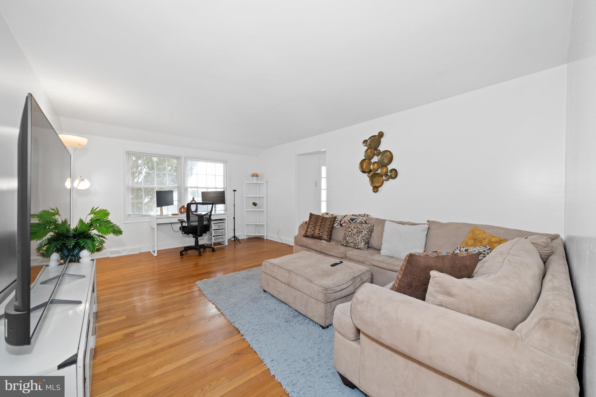 18 George Read Road New Castle, DE 19720 - Photo 12 of 40 a living room with furniture and a couch