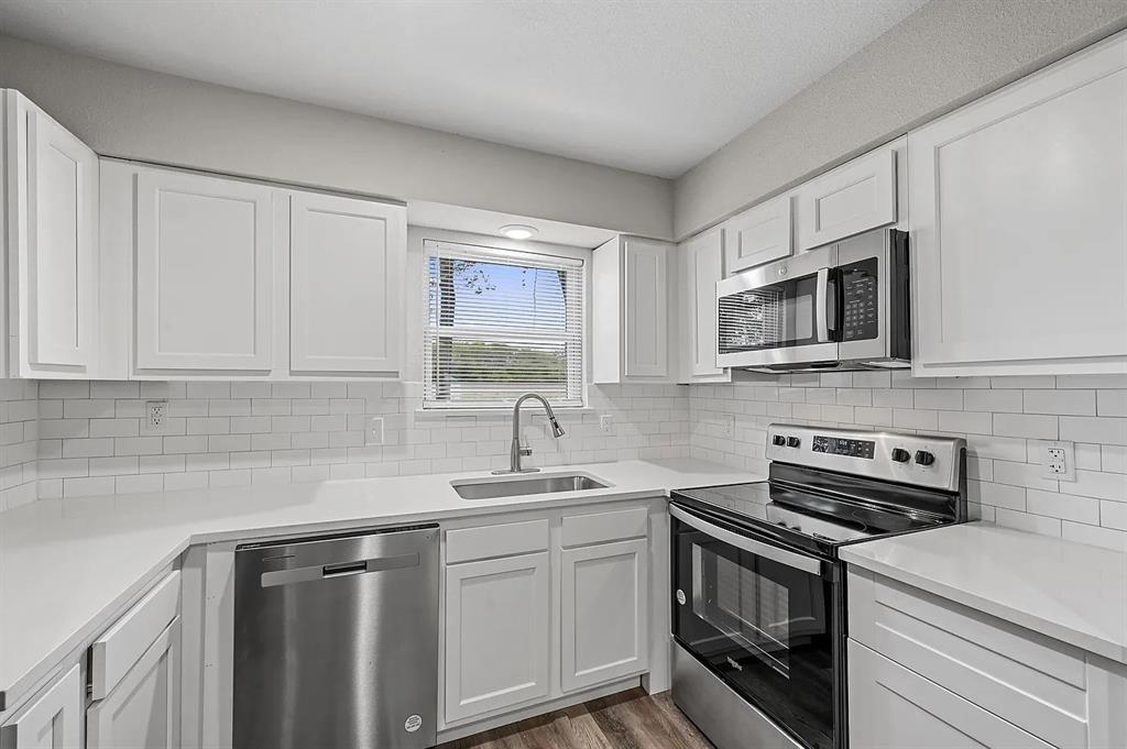 500 Highway 75, Unit 6 Van Alstyne, TX 75495 - Photo 2 of 9 a kitchen with a sink stove and microwave