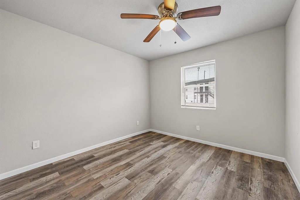 500 Highway 75, Unit 6 Van Alstyne, TX 75495 - Photo 5 of 9 an empty room with a window and a fan