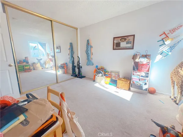 a bedroom with furniture and a window