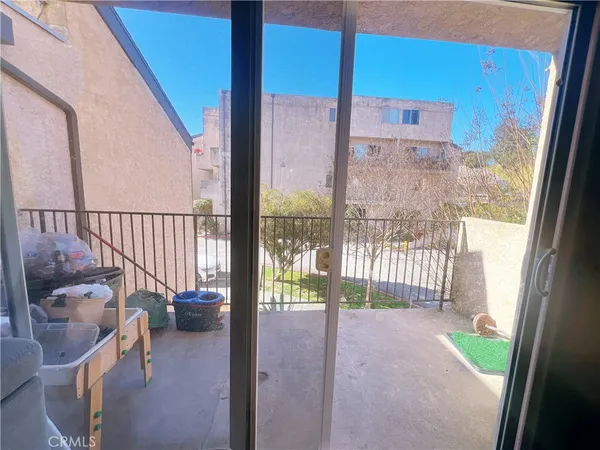 a view of a balcony with chair