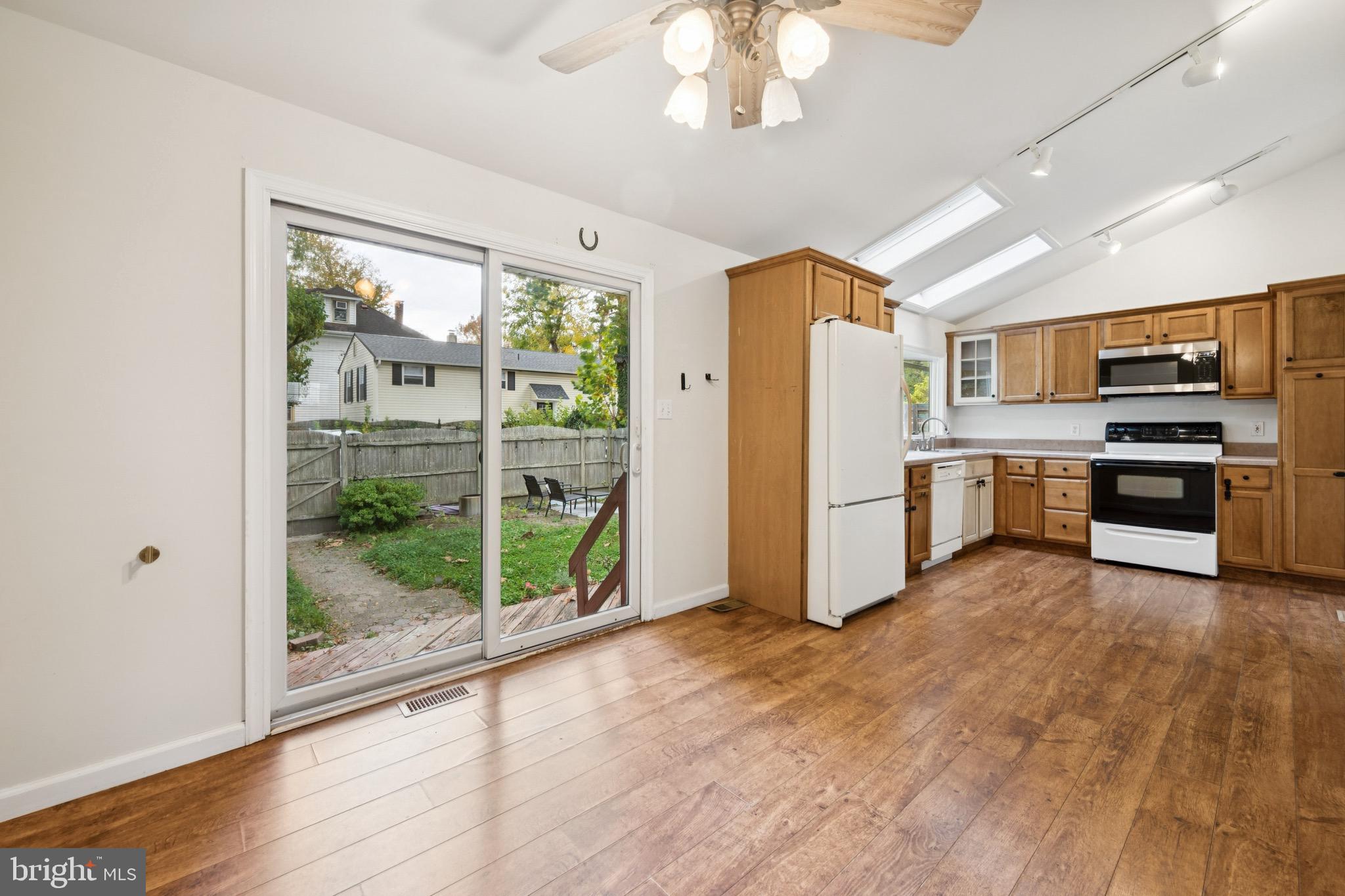 166 Ellis Street Haddonfield, NJ 08033 - Photo 13 of 25 a view of a kitchen with a stove cabinets and wooden floor