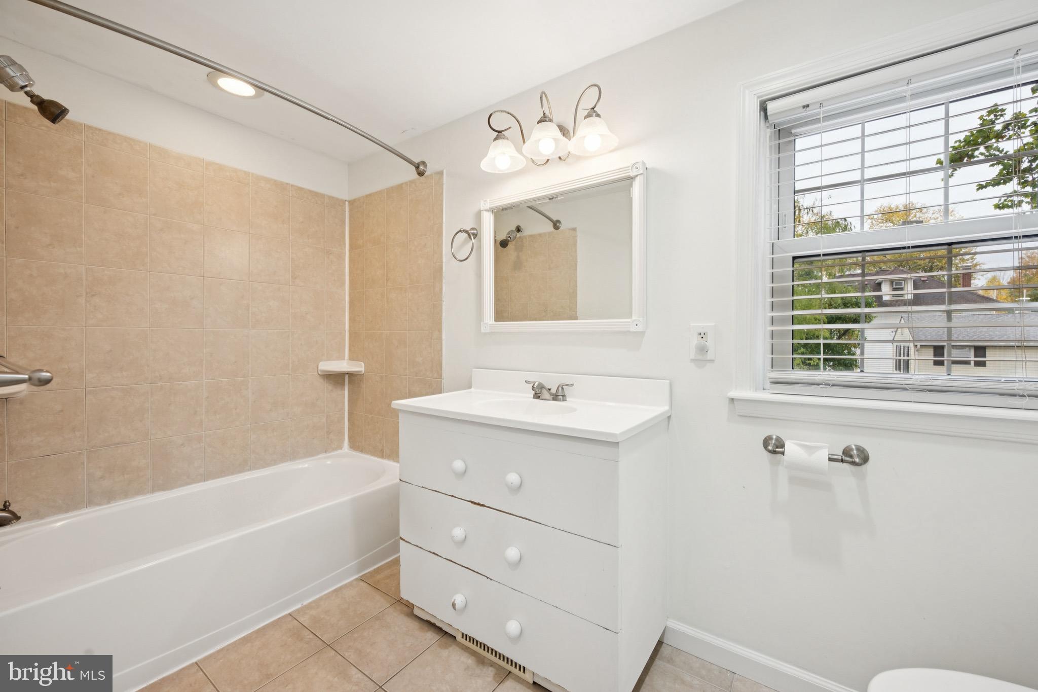 166 Ellis Street Haddonfield, NJ 08033 - Photo 22 of 25 a bathroom with a tub sink and mirror