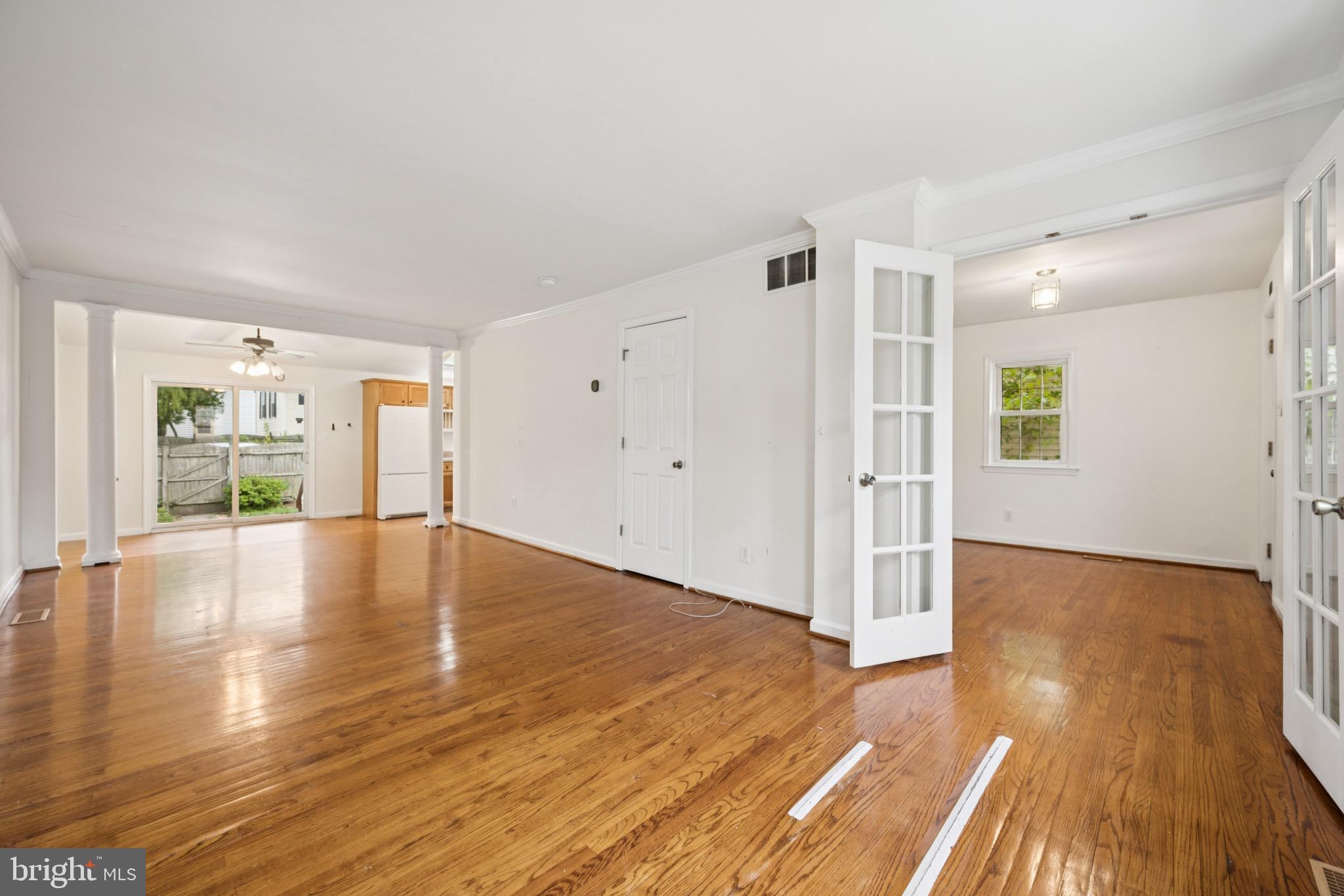 166 Ellis Street Haddonfield, NJ 08033 - Photo 7 of 25 a view of empty room with wooden floor and fireplace