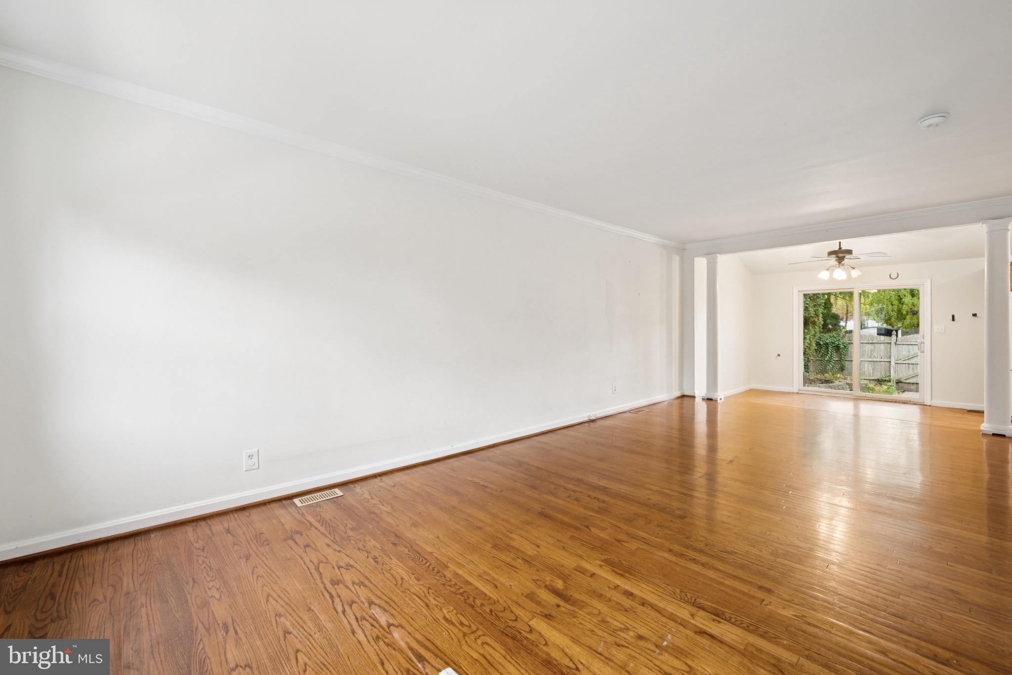 166 Ellis Street Haddonfield, NJ 08033 - Photo 10 of 25 a view of an empty room with wooden floor and windows