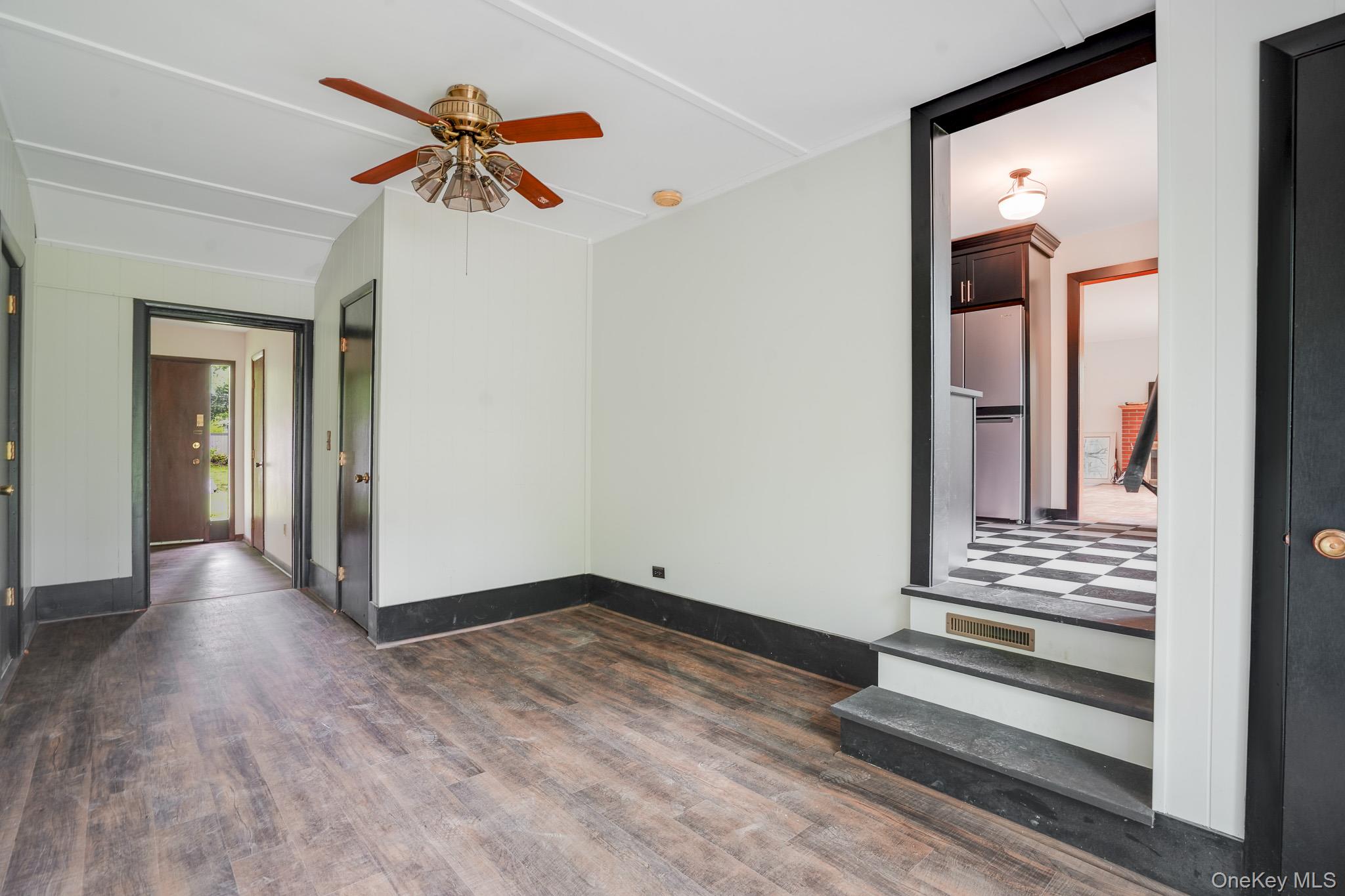 84 Sleight-Plass Road Poughkeepsie, NY 12603 - Photo 12 of 30 a view of a hallway with wooden floor and a ceiling fan
