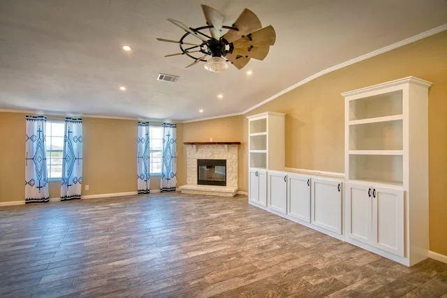 a room with pool table and outdoor view