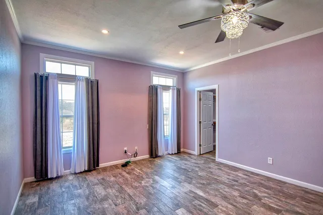 a bathroom with a tub sink shower and mirror