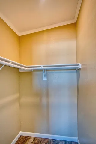 a white toilet sitting next to a bath tub