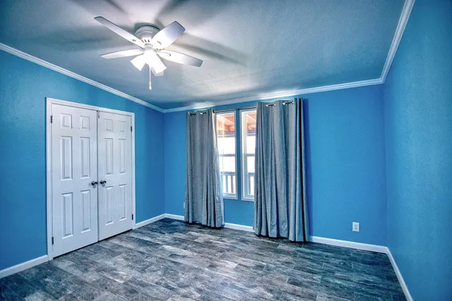 a view of a livingroom with wooden floor