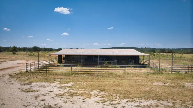 a view of a swimming pool with outdoor seating