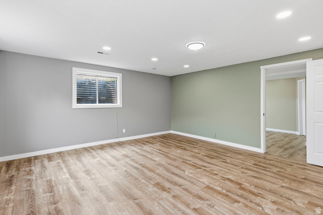 2693 Teal Way Sandy, UT 84093 - Photo 32 of 50 Spacious interior room featuring wood-finish flooring, recessed lighting, and a window with blinds