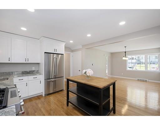 21 Coronet Avenue Methuen, MA 01844 - Photo 12 of 28 a kitchen with refrigerator cabinets and wooden floor