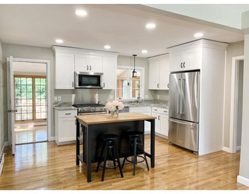 21 Coronet Avenue Methuen, MA 01844 - Photo 2 of 28 a kitchen with stainless steel appliances granite countertop a refrigerator and a stove top oven