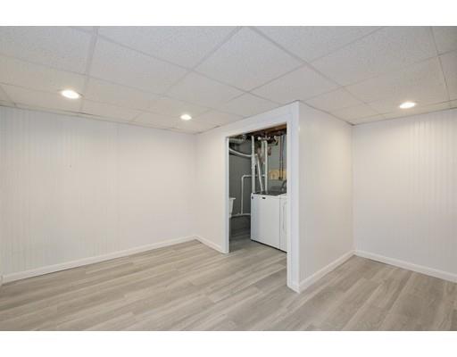 21 Coronet Avenue Methuen, MA 01844 - Photo 22 of 28 a view of an empty room with wooden floor and a window