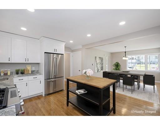 21 Coronet Avenue Methuen, MA 01844 - Photo 3 of 28 a kitchen with stainless steel appliances kitchen island granite countertop a refrigerator a stove a dining table and chairs