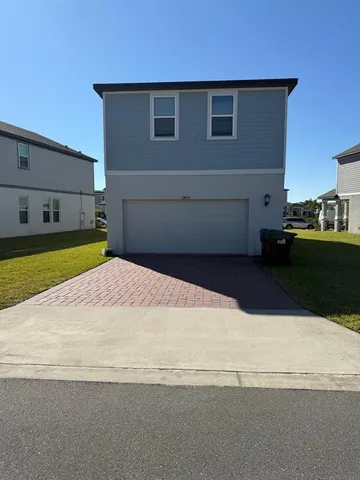 a view of a backyard of the house