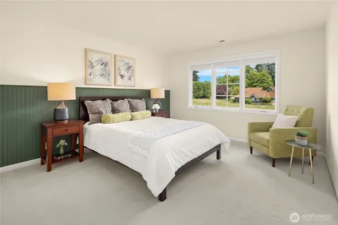 a bed room with a bed and a chair